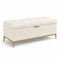 Banc de rangement en tissu beige avec pieds en métal doré