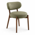 Chaise en bois noyer et cuir synthétique vert